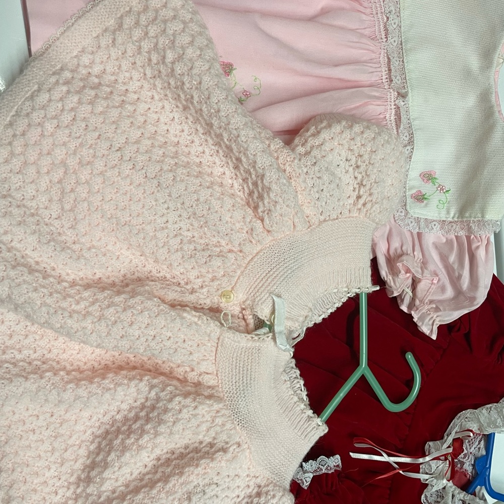 2 dresses and one sweater. One pair of socks and diaper cover